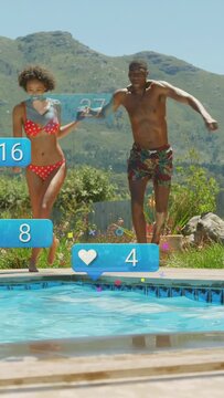 Vertical video: Reacting to rising blue bubbles, couple in red bikini and trunks leaping into pool