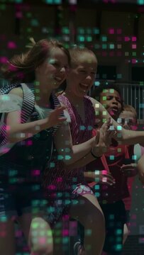 Vertical video: Lead kids initiating running across lawn pixel grid overlay highlighting school toy