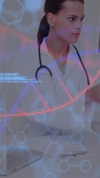 Vertical video: Doctor tapping tablet as medical overlays sweeping across view, revealing DNA helix