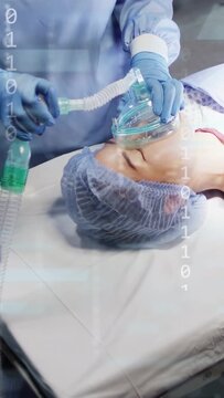 Vertical video: Patient needing oxygen getting mask as nurse holding tube, binary overlay showing