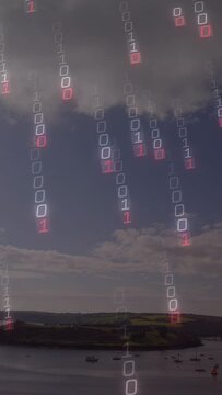 Vertical video: Glowing bit popping under clouds sending falling bit rain over bay showing data