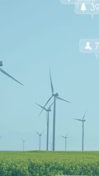 Vertical video: Bell pulsing turbines turning social icons with likes camera panning showing reach
