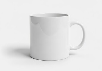 Obraz premium Isolated plain white ceramic coffee mug for branding design, empty porcelain drinkware cup with handle for tea or espresso drinks
