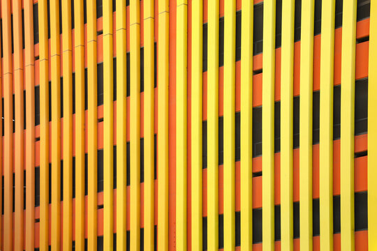 Orange and yellow striped architectural facade