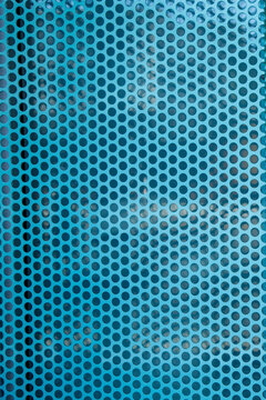 Blue perforated panel pattern background