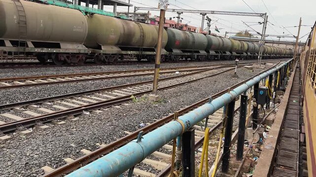 indian railways freight wagons carrying petrol and diesel along railway tracks