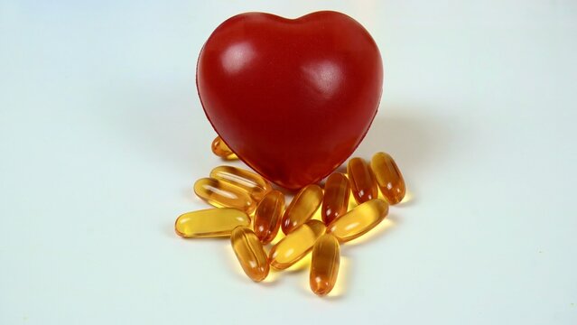 Red heart and omega-3 pills for health