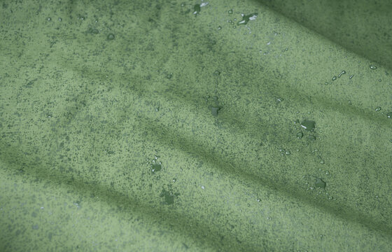 Waterproof fabric texture with rain drops closeup