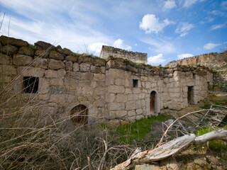 Fototapeta premium Traditional Cave Houses and Rock Homes in Belisırma Village, Ihlara Valley, Cappadocia, Turkey