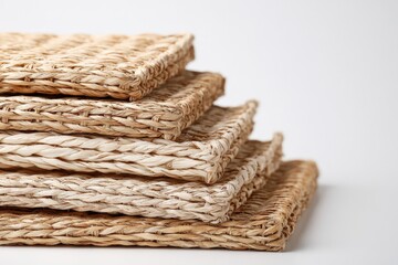 Obraz premium Stack of handwoven natural fiber mats for eco friendly home decor