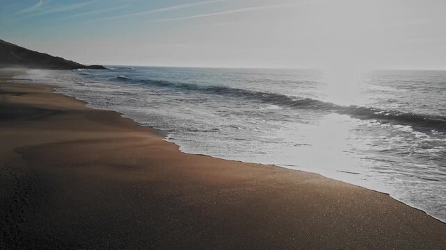 Peaceful sunrise at Praia do Salgado beach, Nazare, Portugal coast