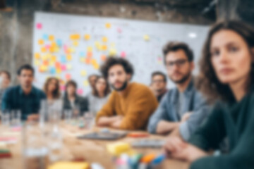 Fototapeta premium Blurred Diverse team engaged in focused meeting with whiteboard