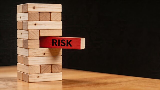 Risk block red wooden jenga piece with text risk business strategy investment challenge corporate management uncertainty concept