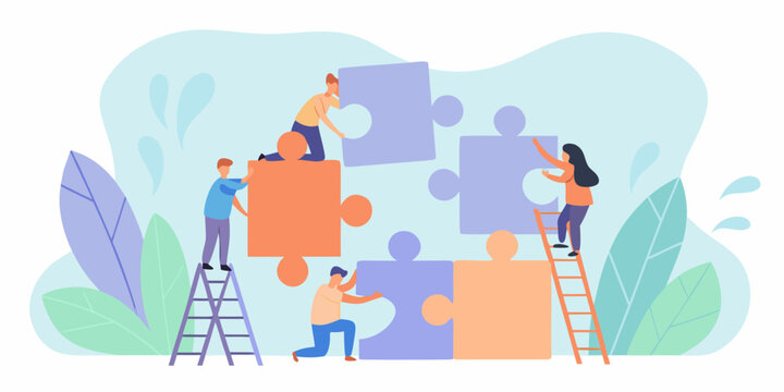 Teamwork concept with people fitting puzzle pieces together