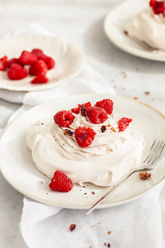 Mini pavlova with rose cream & raspberries