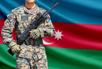 Obraz premium Azerbaijan flag with soldier holding assault rifle