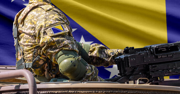 Bosnia and Herzegovina flag with soldier at machinegun turret