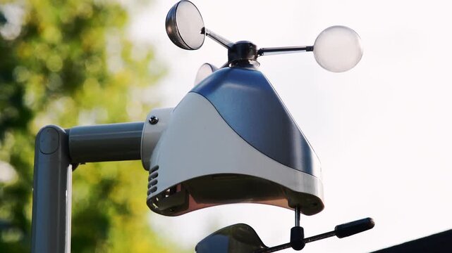 Professional digital weather station anemometer measuring wind speed outdoors. Modern meteorological sensor for climate monitoring and forecasting