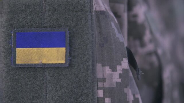A Ukrainian soldier in a pixelated uniform. Russia vs. Ukraine.