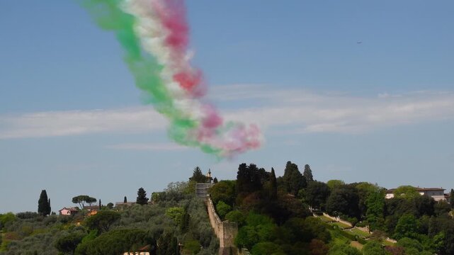 red white and green Italian flag drawn in the sky over Florence city by the Frecce Tricolori. Italian Air Force Aerobatic Team on Aermacchi MB-339.