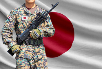 Fototapeta premium Japan flag with soldier holding assault rifle