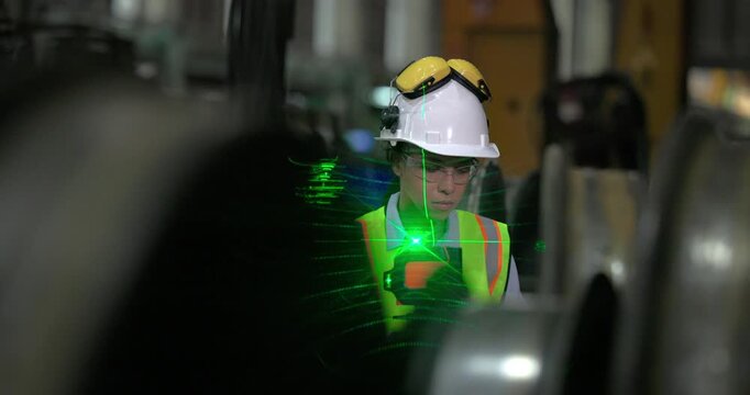 A locomotive engineer in a factory setting uses a laser measuring tool, demonstrating the precision and technical skills required in industrial engineering and construction environments.
