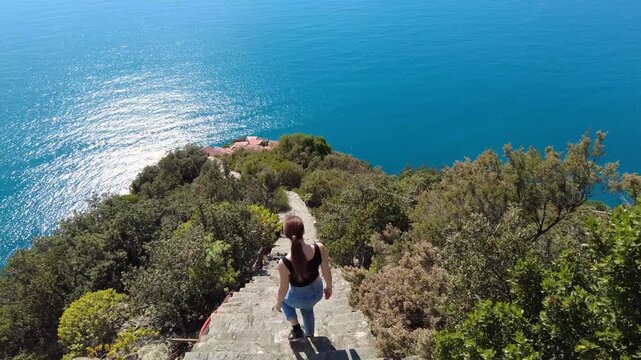 Italy, Liguria, La Spezia - Monesteroli in the Cinque Terre National Park is a small, almost uninhabited village famous for its 2,200-step staircase overlooking the sea, tourist trekking  walking path