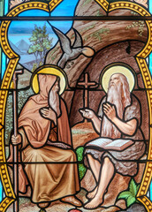 Obraz premium Stained glass of Saint Antony the Great (left) or the Hermit (251-356). Saint of the Roman Catholic Church.