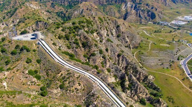 Wide Aerial View of the Los Angeles Aqueduct Cascades and Infrastructure in the Santa Clarita Foothills