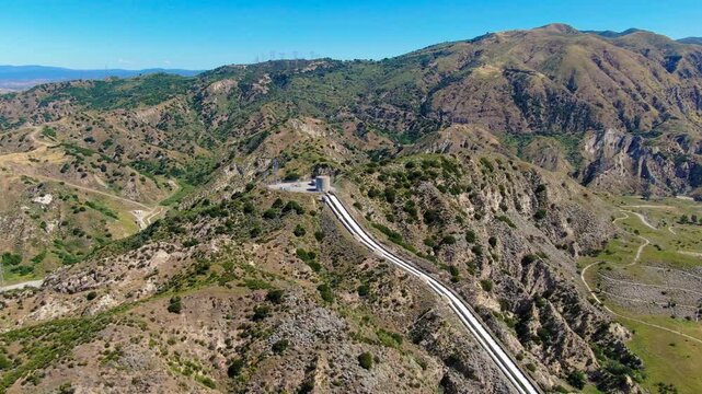 Wide Aerial View of the Los Angeles Aqueduct Cascades and Infrastructure in the Santa Clarita Foothills