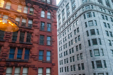 Fototapeta premium Views of Historic Buildings on a Street in Downtown Pittsburgh During the Day With Contrasting Architecture Styles