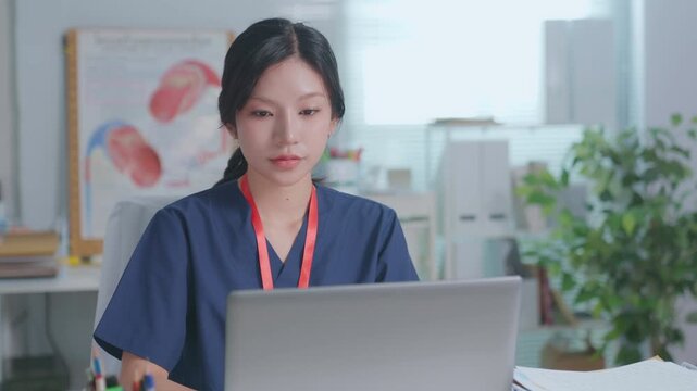 Doctor entering electronic medical records. Medical, asian woman working with computer in medical consultation at hospital. which are recording diagnoses and patient symptoms. Healthcare and medicine