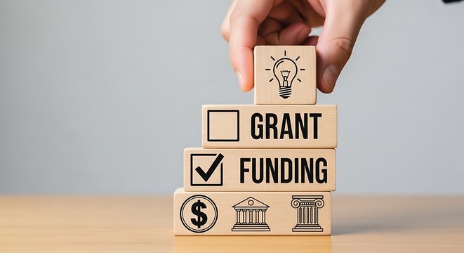 The process of securing grant funding illustrated through a visual metaphor of building blocks and financial support