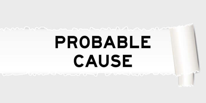 Ripped gray paper background that have word probable cause under torn part