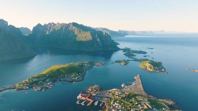 Aerial drone view of Reine, Lofoten islands, Norway. Scenic summer video with mountains, islands and ocean. A famous place. Travel and vacation in Scandinavia.