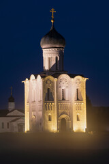 Fototapeta premium The medieval Church of the Intercession on the Nerl on a September night. Bogolyubovo, Russia