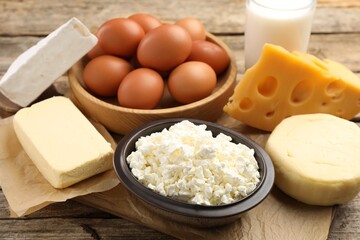 Fototapeta premium Different dairy products and eggs on wooden table, closeup