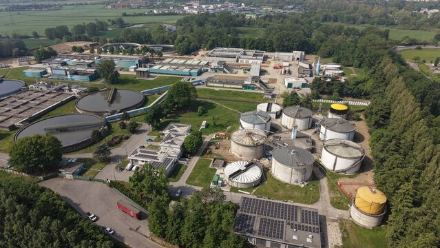 Aerial view of anaerobic digesters at the Peschiera Borromeo wastewater treatment facility, highlighting modern water management and renewable energy infrastructure.