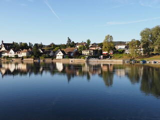 Fototapeta premium Houses at bank of Rhine River in STEIN AM RHEIN town in SWITZERLAND