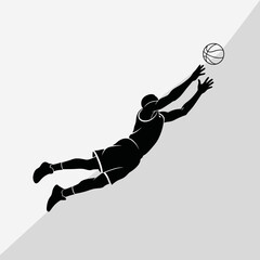 Silhouette of a basketball player making a spectacular catch. © indah