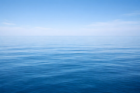 Peaceful ocean surface with clear horizon under blue sky, minimal seascape background ideal for calm, nature and meditation themes.