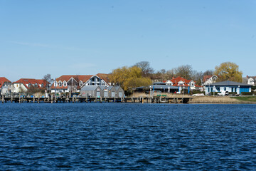 Fototapeta premium Germany, Mecklenburg Vorpommern, Rerik, April 8, 2026: Rerik harbor view on Salzhaff with dwellings