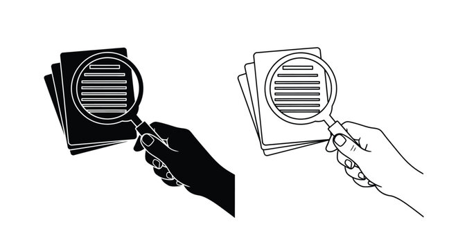 Hand holding magnifying glass over cards duplicated in line art silhouette