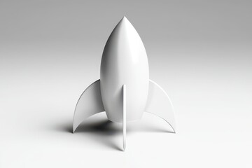 Fototapeta premium Minimalist white rocket ship on a clean studio background, symbolizing space exploration and innovation.