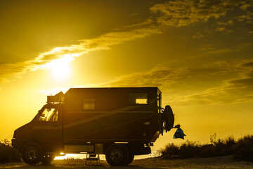 Lorry motorhome with equipment camping on beach at sunrise © Voyagerix
