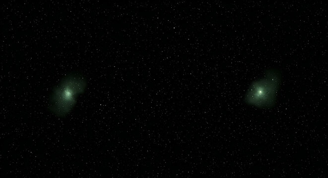Two green celestial objects in a starry night sky
