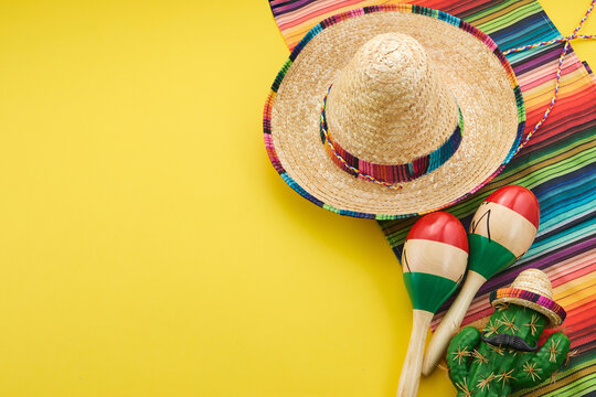 Mexican fiesta celebrating cinco de mayo with sombrero and maracas