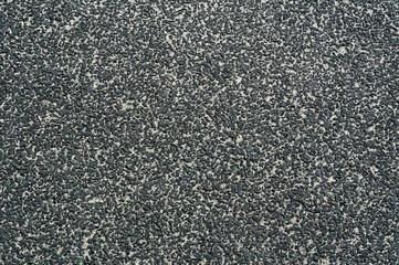 Fototapeta premium Photo for background. Asphalt texture. Playground covering close-up.