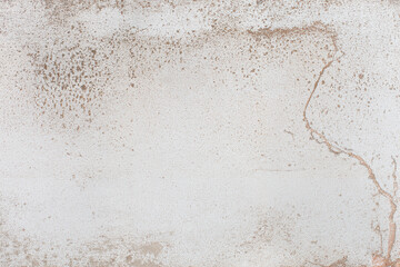 Rough textured concrete surface displays prominent cracks and speckled brown discoloration. © Graphicagfx_overlays
