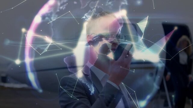 Business exec speaking into phone by jet, sparking net map into globe circling him guiding boarding